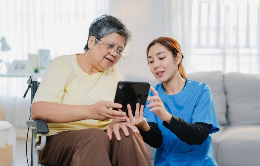 A caregiver calmly managing a loved one's health records on a tablet using an app.